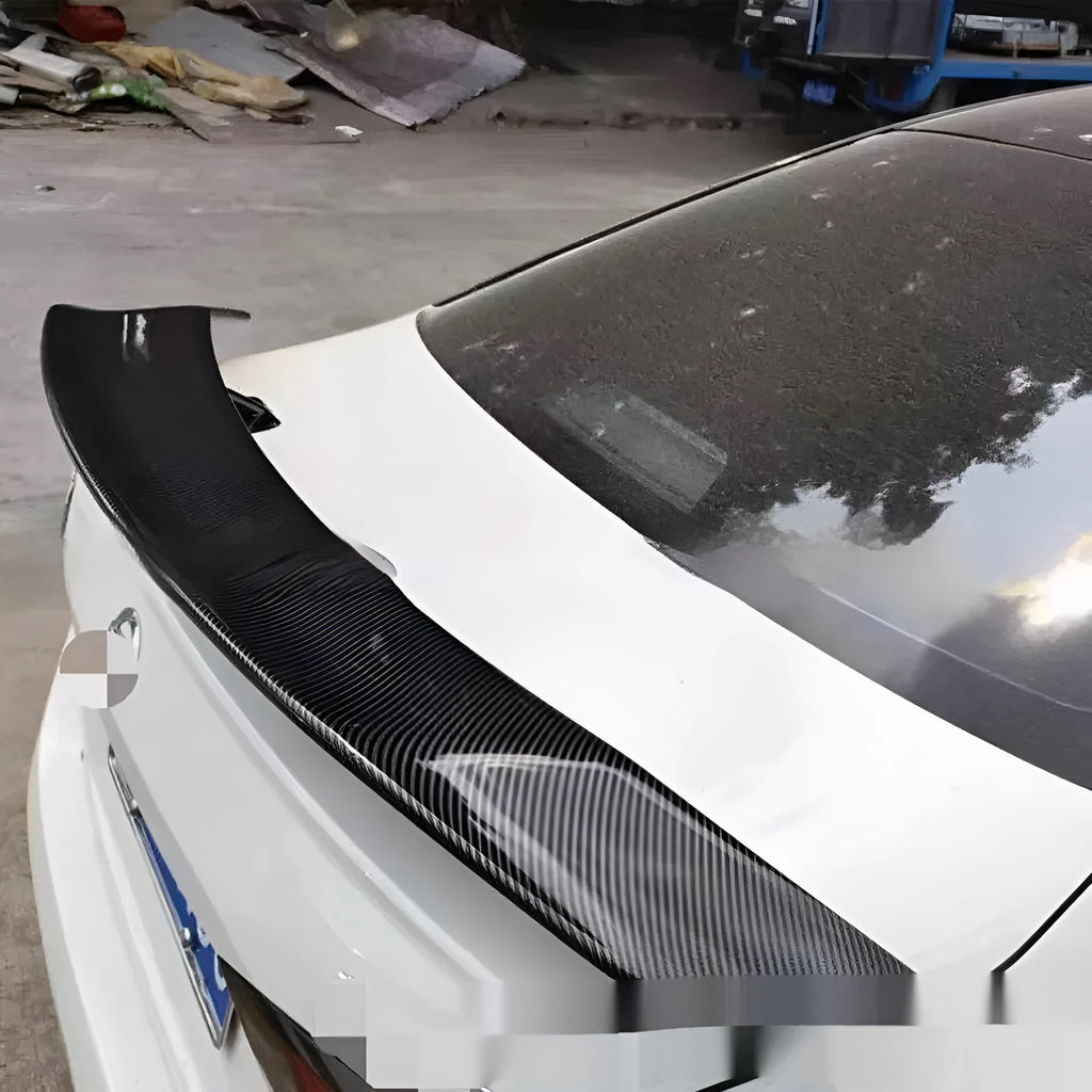 Universal punch-free car spoiler in ABS plastic with adhesive mounting