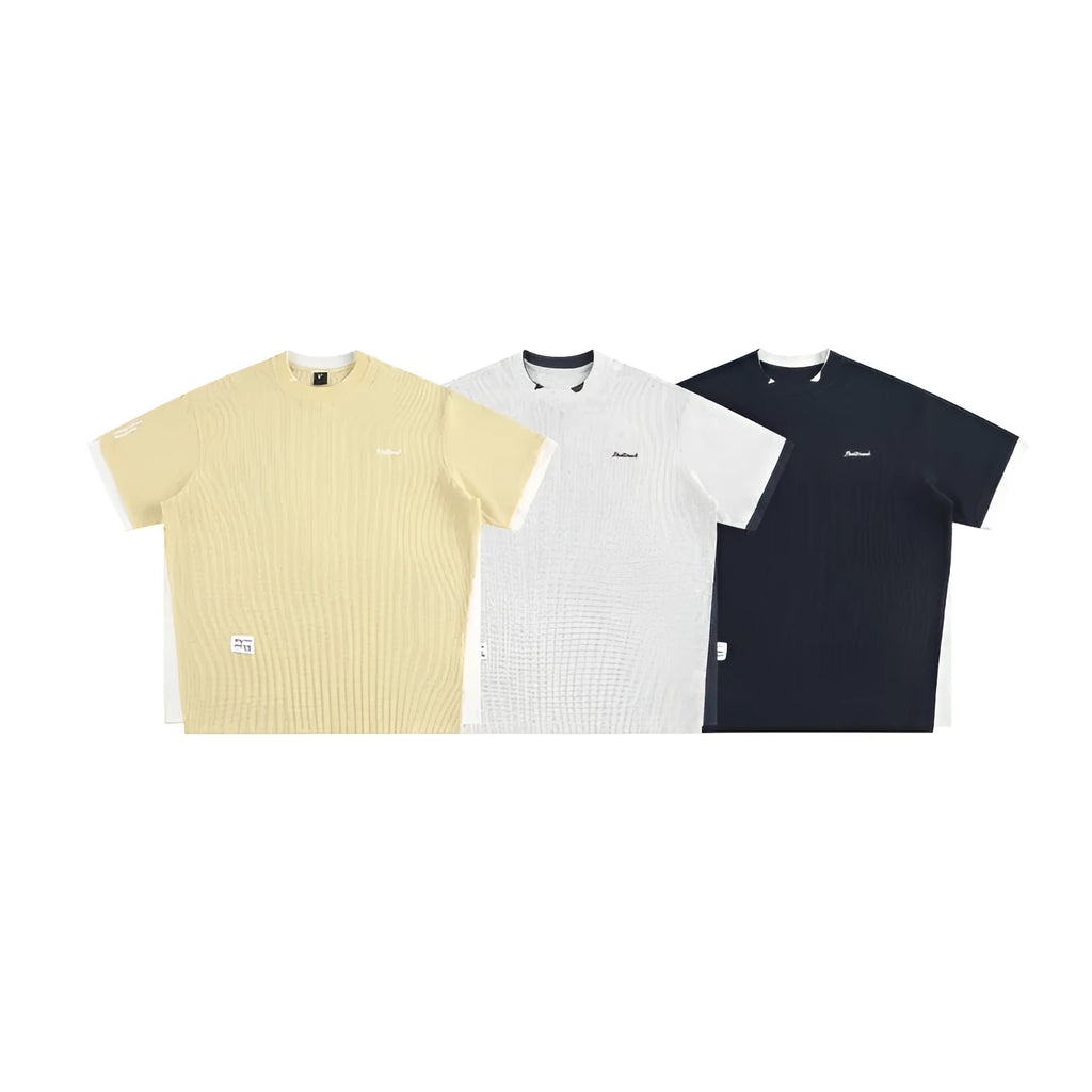Loose fit short-sleeved waffle fabric t-shirt with retro alphabet embroidery, shown in yellow.