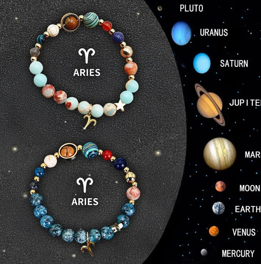 Set of two natural stone beaded bracelets for twelve zodiac signs on a wooden surface.