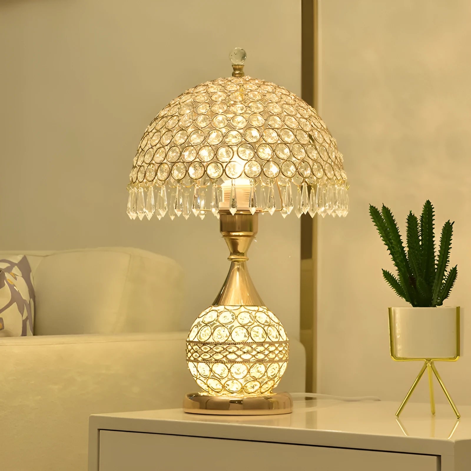 Gold crystal desk lamp with iron art base and remote control on wooden table