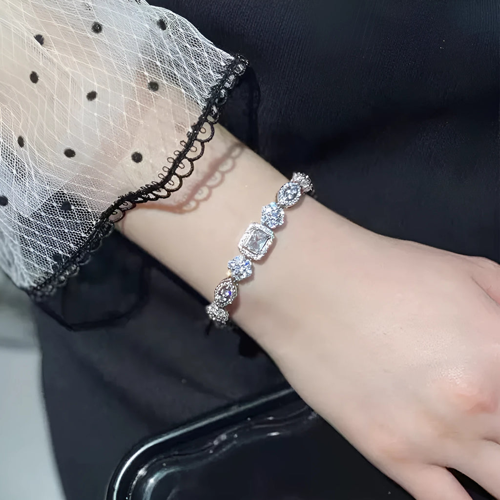 Women's geometric bracelet with silver and white gold plating and sparkling inlaid zircon stones.