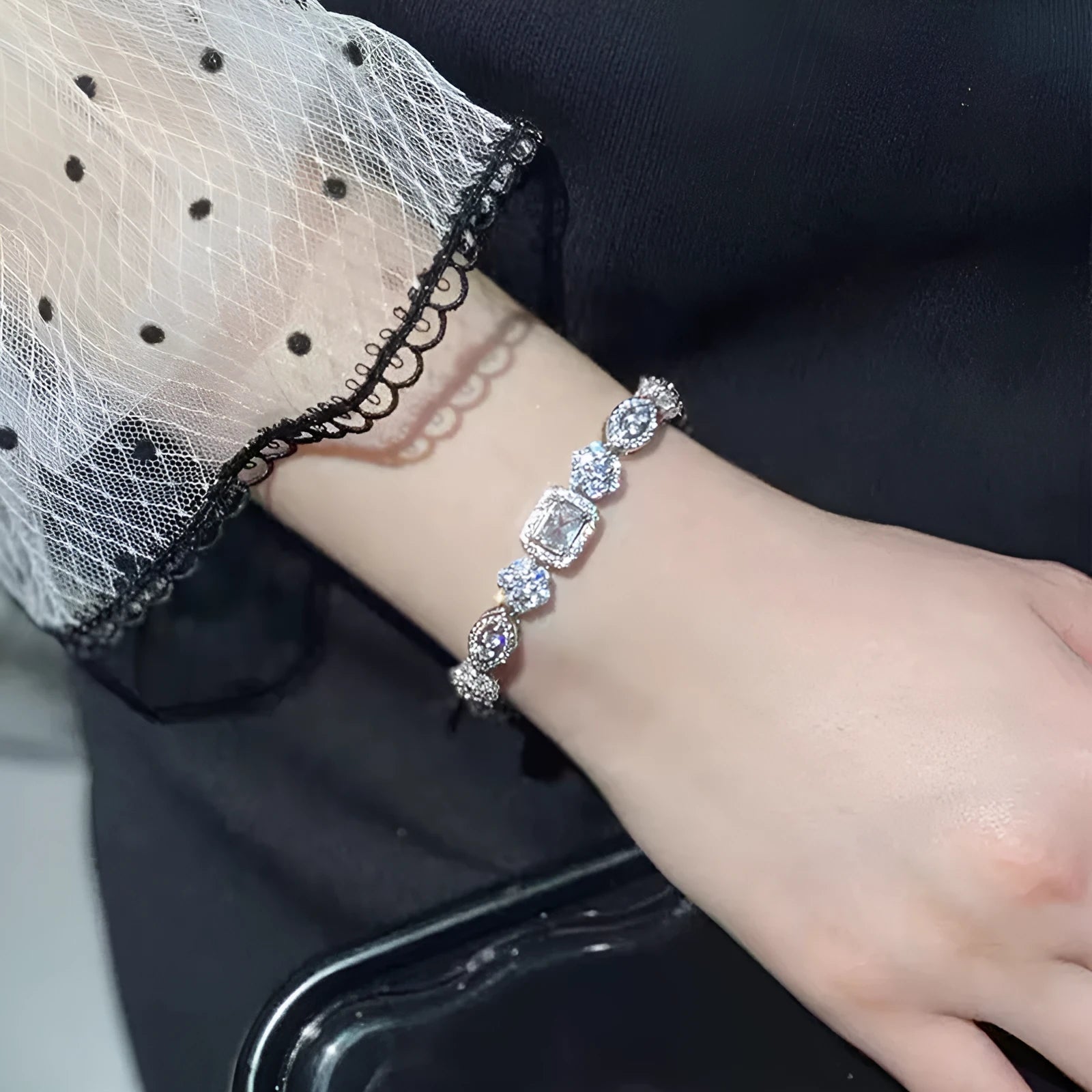 Women's geometric bracelet with silver and white gold plating and sparkling inlaid zircon stones.