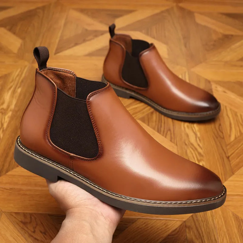 Black and brown formal pointed-toe leather boots with a square heel and rubber sole.