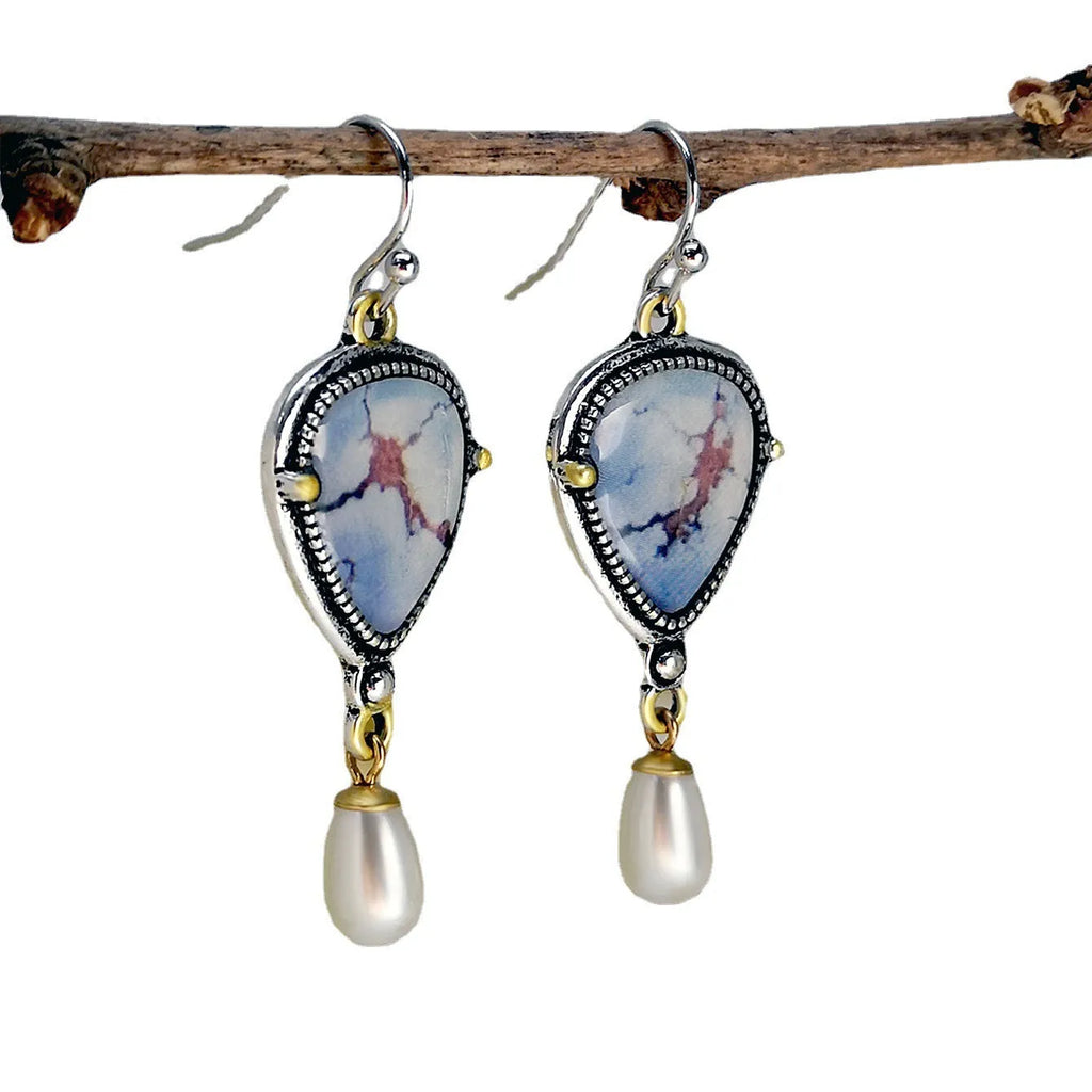 Retro blue drop earrings with electroplated metal, synthetic blue opal, and white pearl geometric design