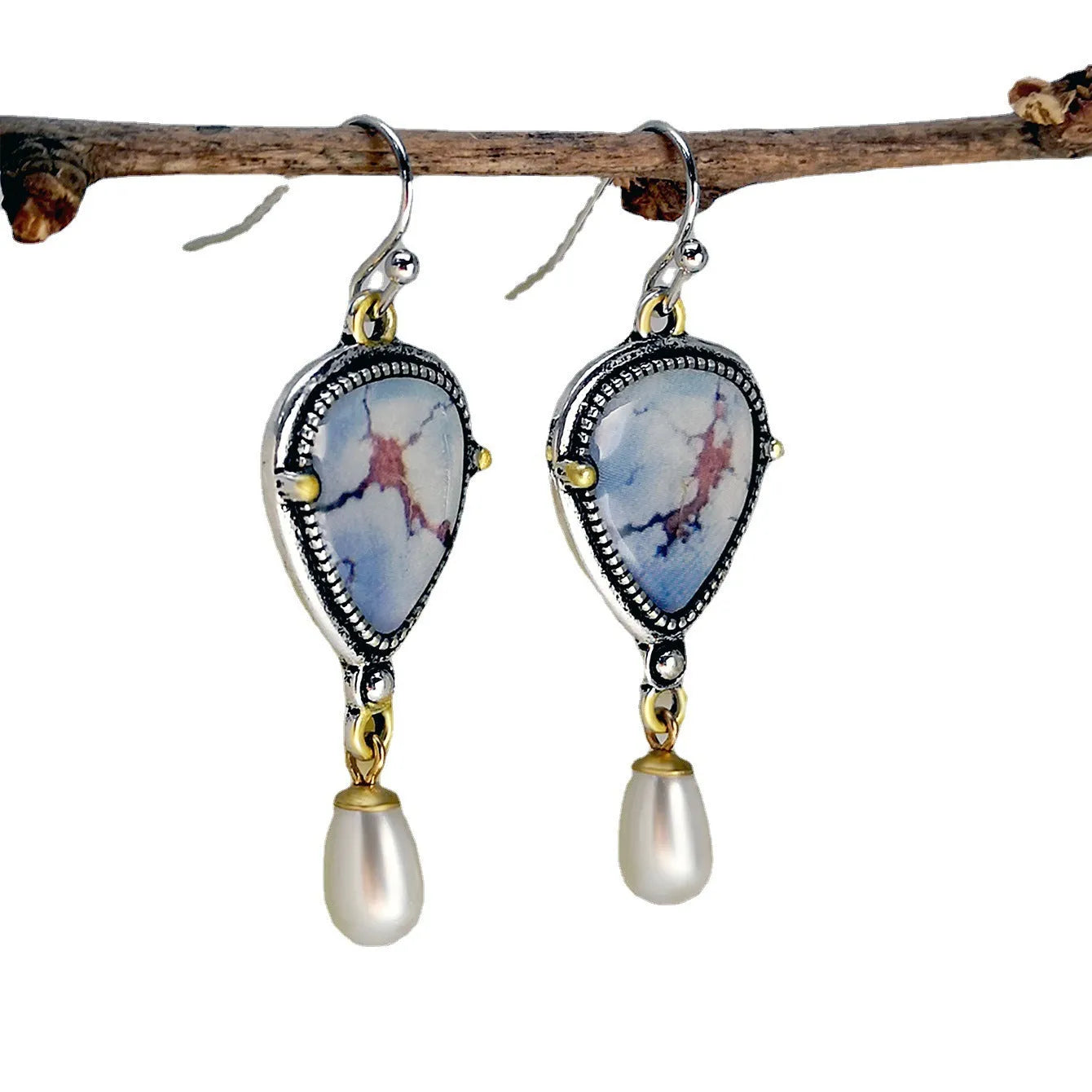 Retro blue drop earrings with electroplated metal, synthetic blue opal, and white pearl geometric design