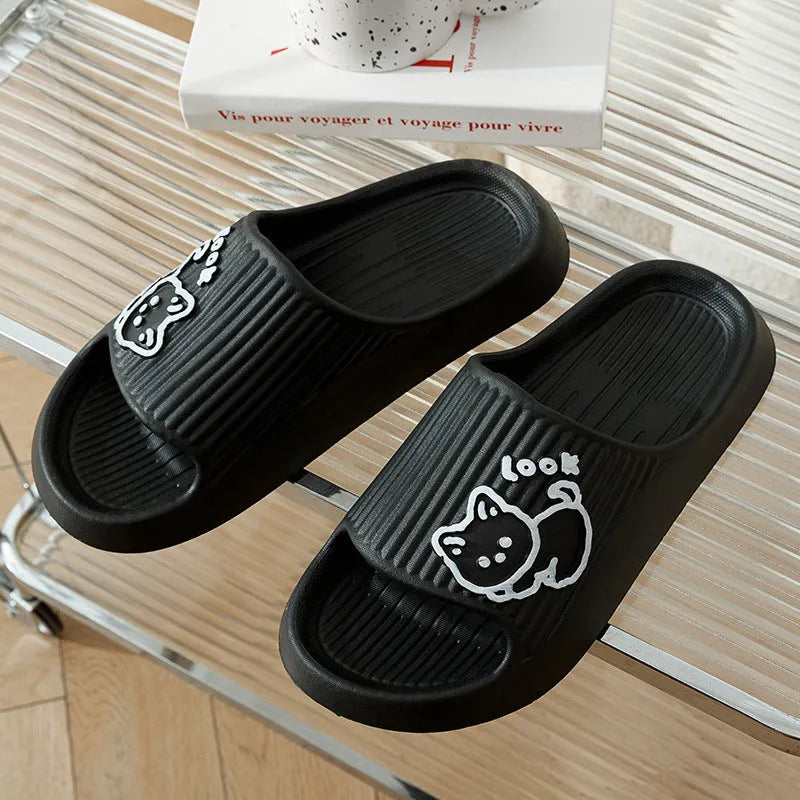 Green EVA platform flip flop slippers with a raised cat design on the upper.
