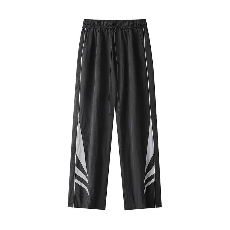 Men's straight-leg sports trousers in black with elastic waistband and button front