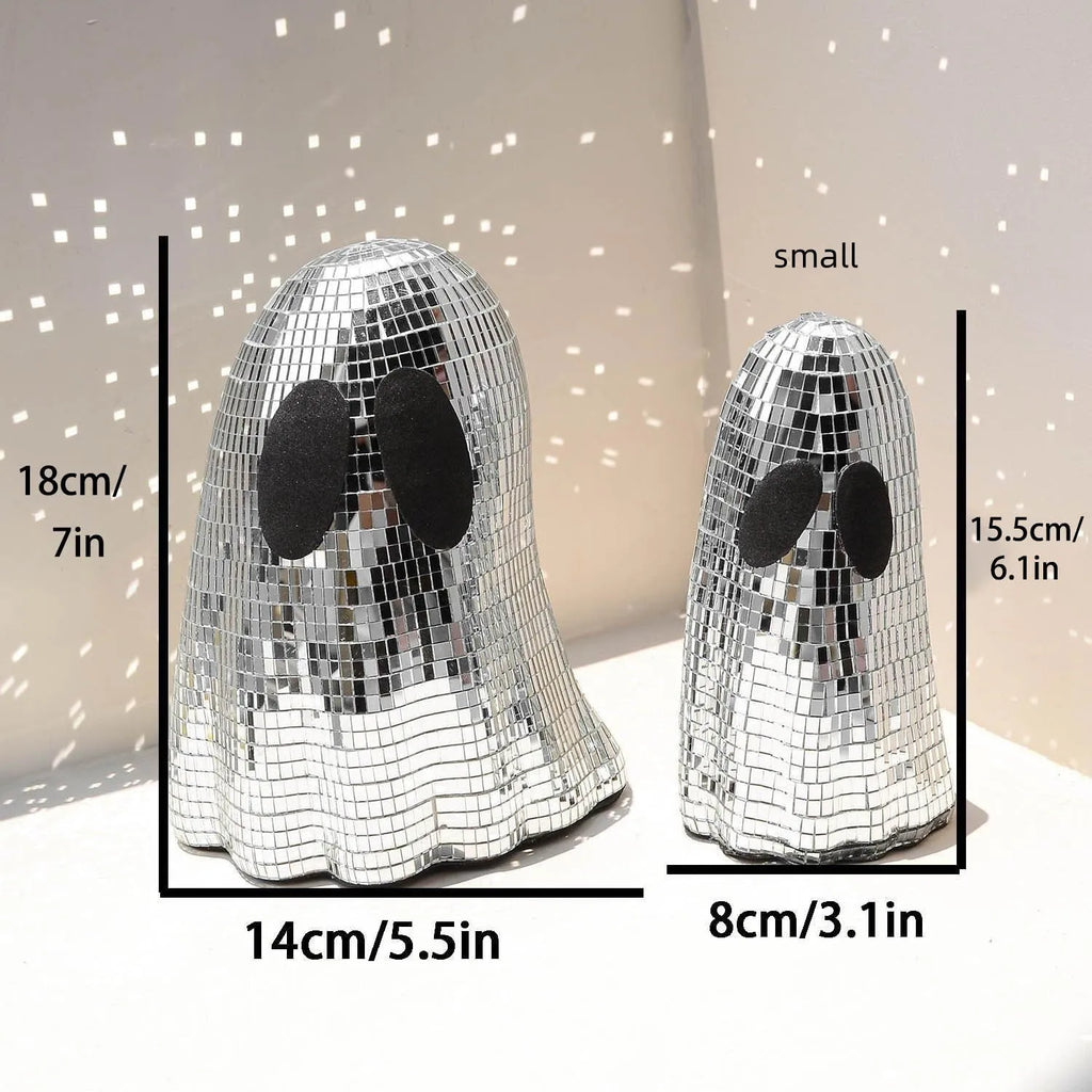 Silver Halloween ghost ornament with mosaic glass surface on wooden desk