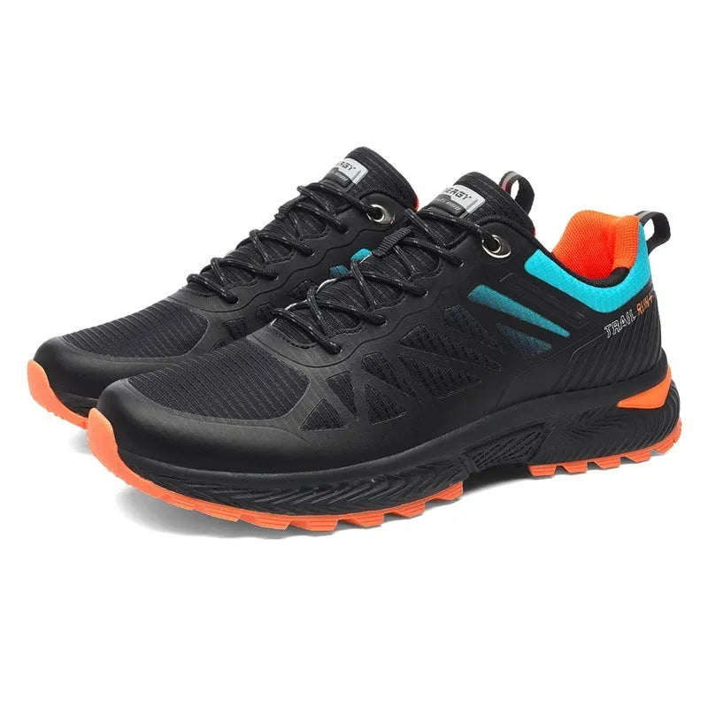 Men's black and orange mesh outdoor running shoe with round toe and flat heel on a rubber sole.