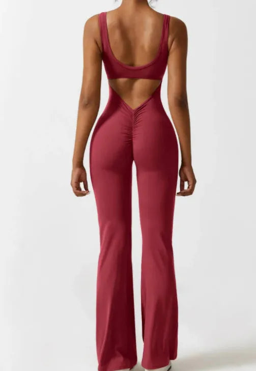 Women's black milk silk yoga bodysuit with seamless design and mid waist.