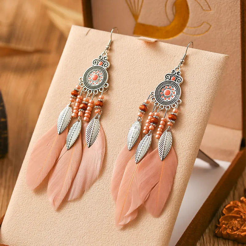 Round drop feather earrings with leaf detailing in various bohemian colours