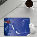 Custom cartoon thickening mouse pad on a desk, showing a colourful design with black stitched edge.
