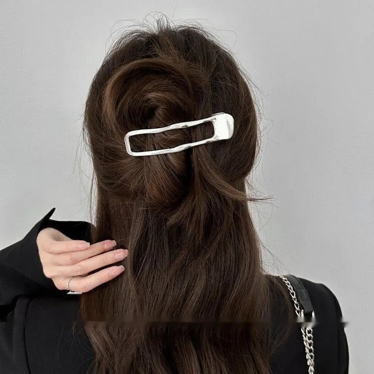 Women's zinc alloy hair barrettes in gold and silver with arc, square, and triangle shapes