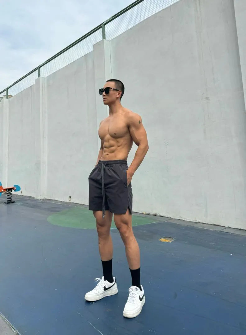 Men's ice silk quick-drying double-layer shorts in six colour options with quarter-length design