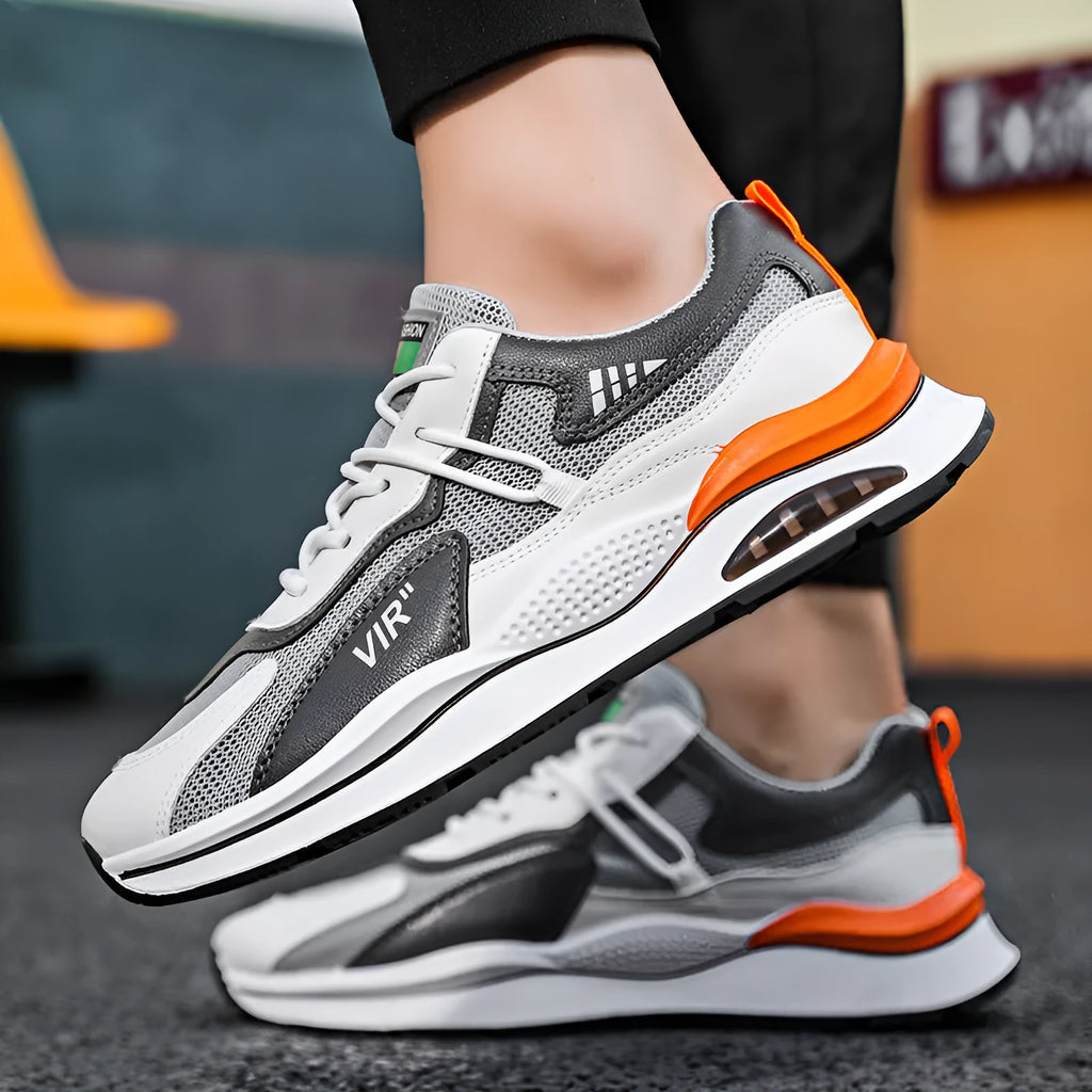 Men's gray breathable mesh running shoes with a round toe and casual sewing thread details on a white background.