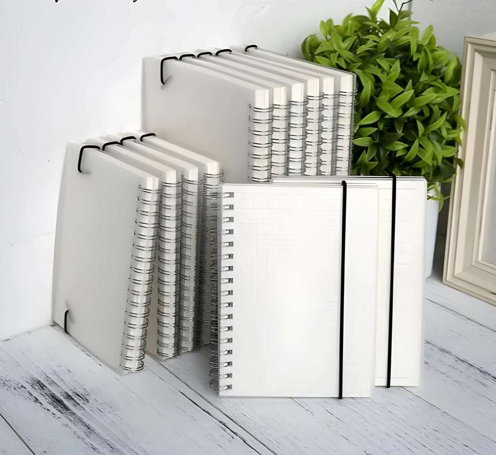 Plastic cover bound spiral coil notebook with cream paper pages and elastic rope closure in A5 size