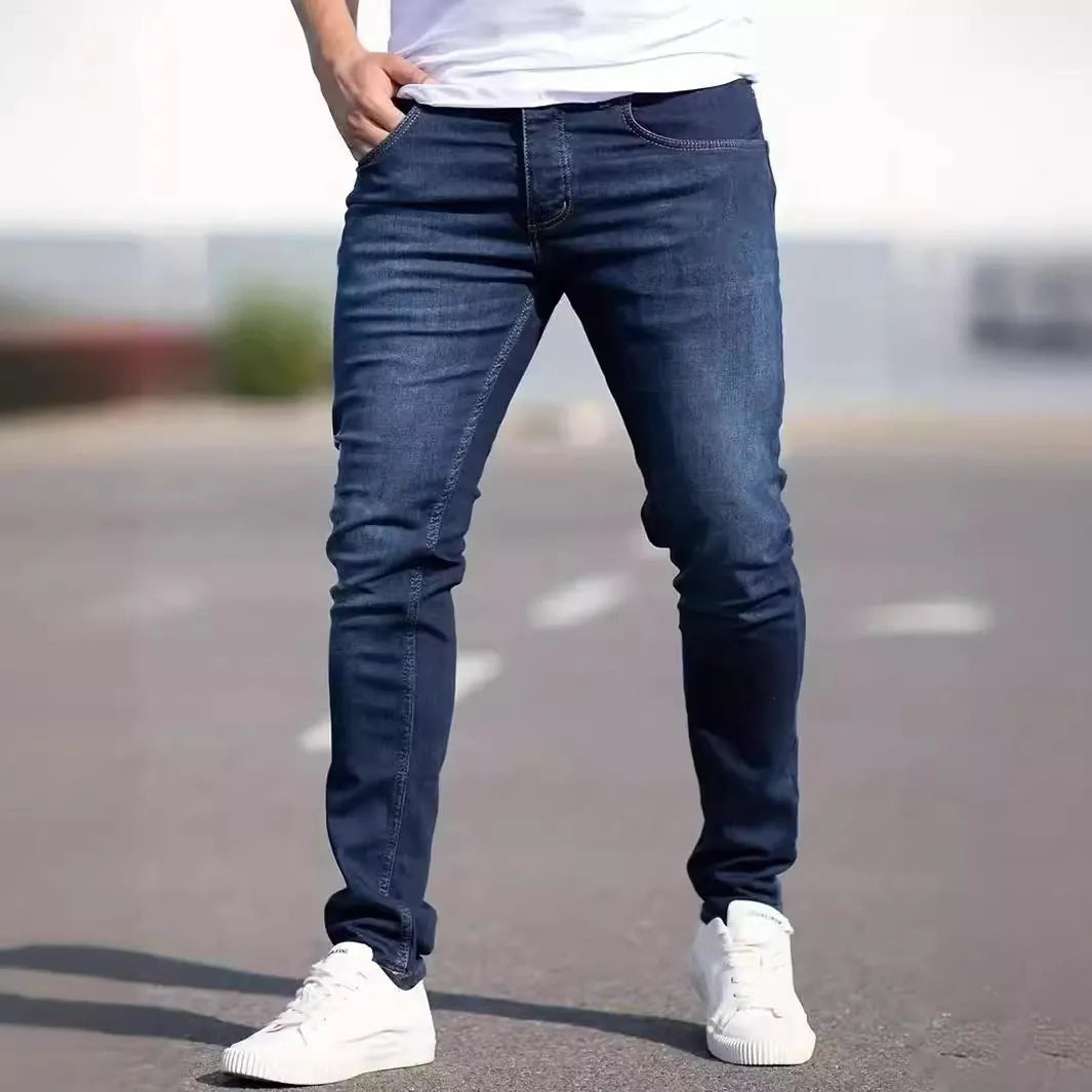 Men's dark blue slim casual jeans with skinny leg style and mid-waist cut