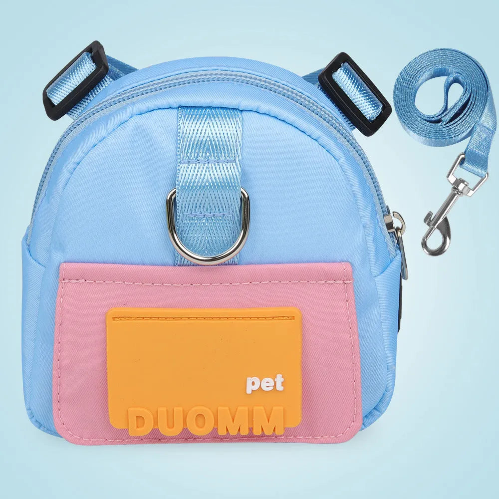 Blue adjustable dog backpack harness with storage compartments and a tow rope, shown on a medium-sized dog.