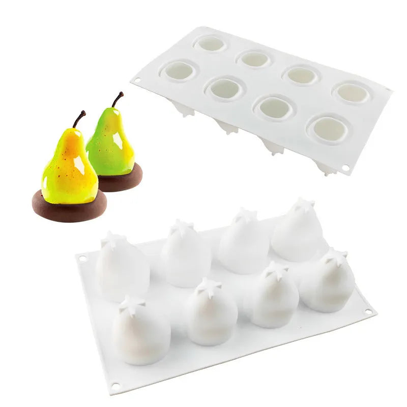 Set of six flexible silicone baking moulds showing pear, pine cone, and pineapple fruit designs.