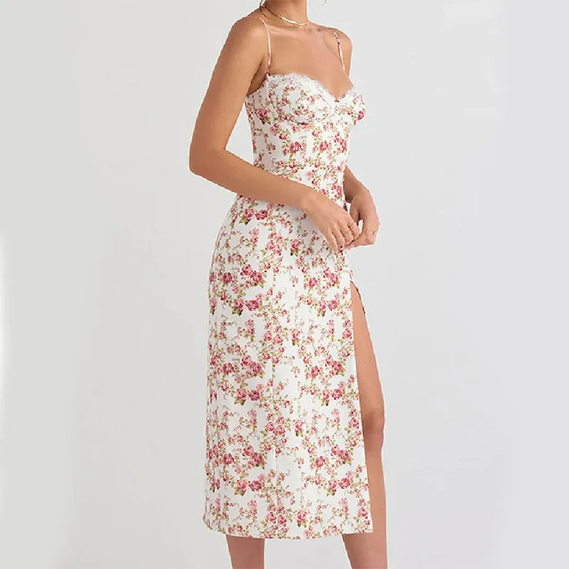 Women's blue long dress with white lace flower print, side slit, and thin adjustable suspender straps.