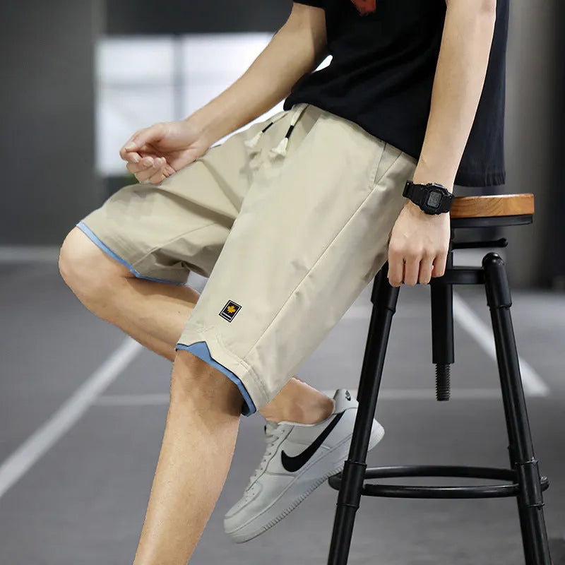 Men's loose-fit straight-leg casual beach shorts in polyester, shown in 8905 Green colour.