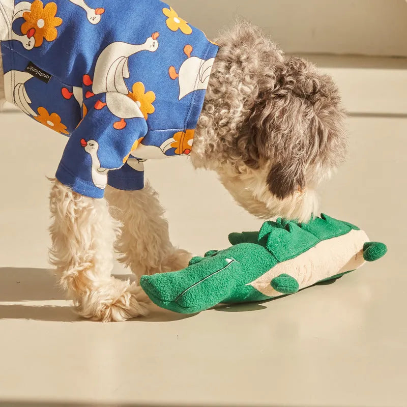Green plush toy dog with soft fabric and beanbag weight for stability