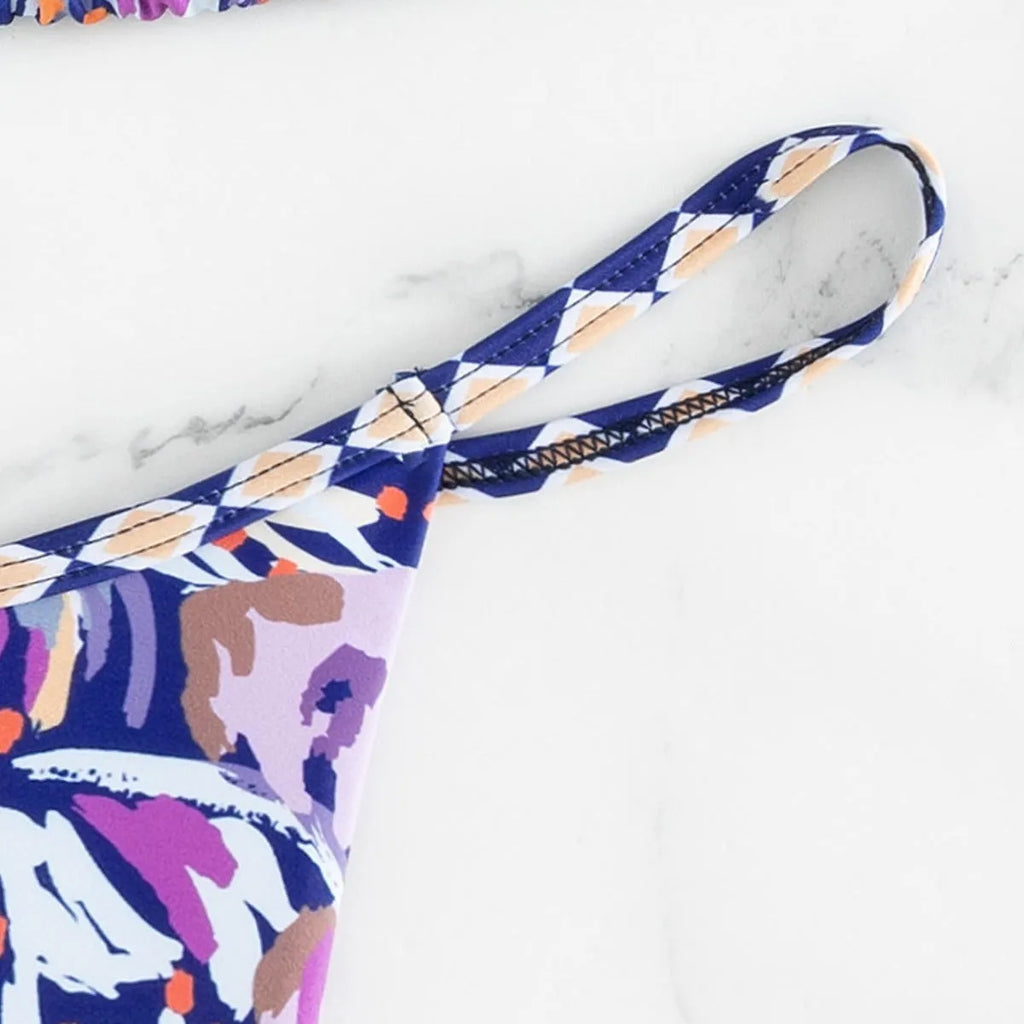 Women's floral printed polyester swimsuit with triangle bag design and briefs style bottom in S, M, L sizes