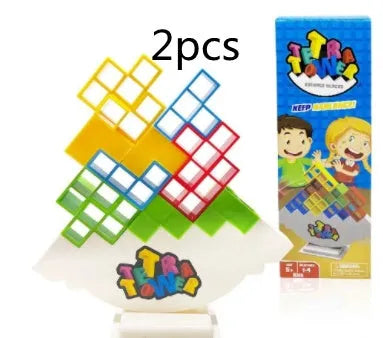 Plastic balance stacking game with 16 coloured building blocks, chassis, and base on a table
