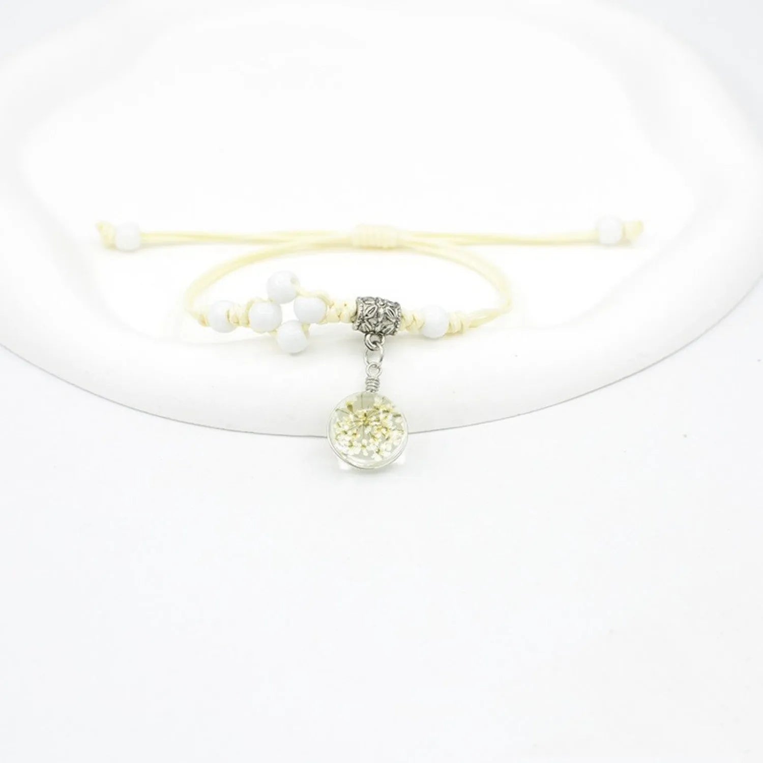 Glass dried flower bracelet with large 1.4cm beads containing real preserved flowers in hand-woven design