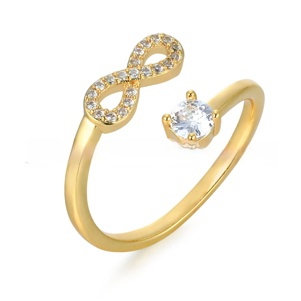 Open geometric metal ring with inlaid zircon letter personalisation in gold finish.