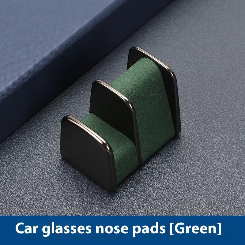 Zinc alloy and leather sunglasses clip for car dashboard storage in four colour options.