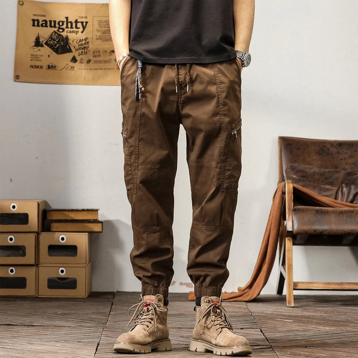 Men's khaki cotton tapered harem pants with an ankle band and loose fit.