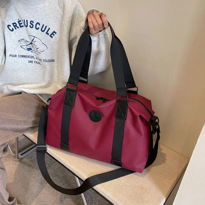 Waterproof Oxford cloth travel bag with 36-55 litre capacity in solid colour design