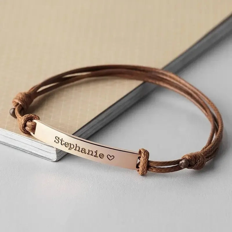 Stainless steel curved inspirational engraved woven stretch wristband in rose gold finish with synthetic leather band