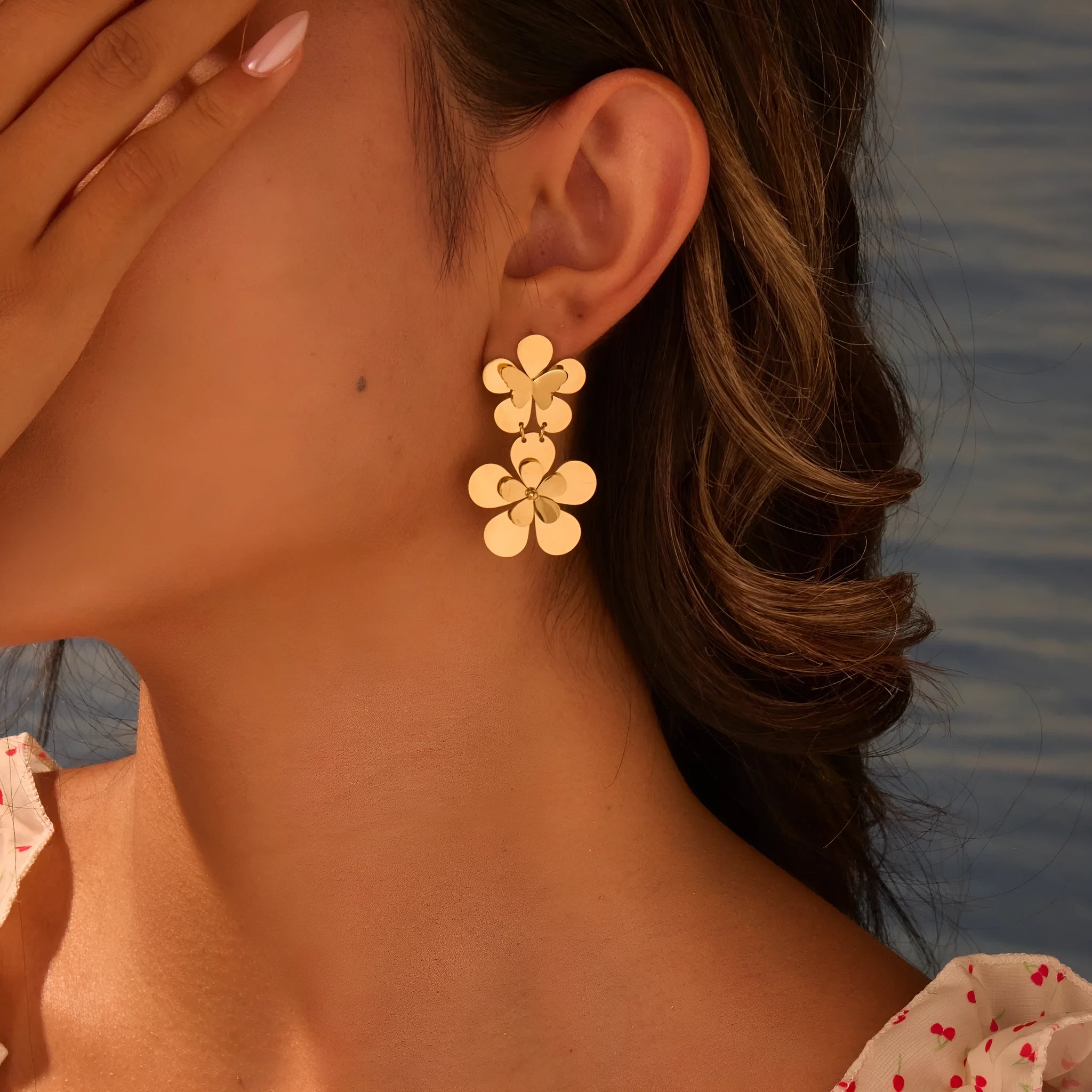 Gold electroplated stainless steel earrings with flower and butterfly designs for women