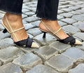 Apricot and black colour block women's stiletto heel sandals with pointed toe and buckle strap.