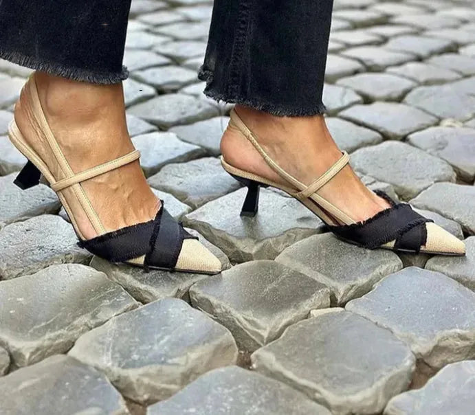 Apricot and black colour block women's stiletto heel sandals with pointed toe and buckle strap.