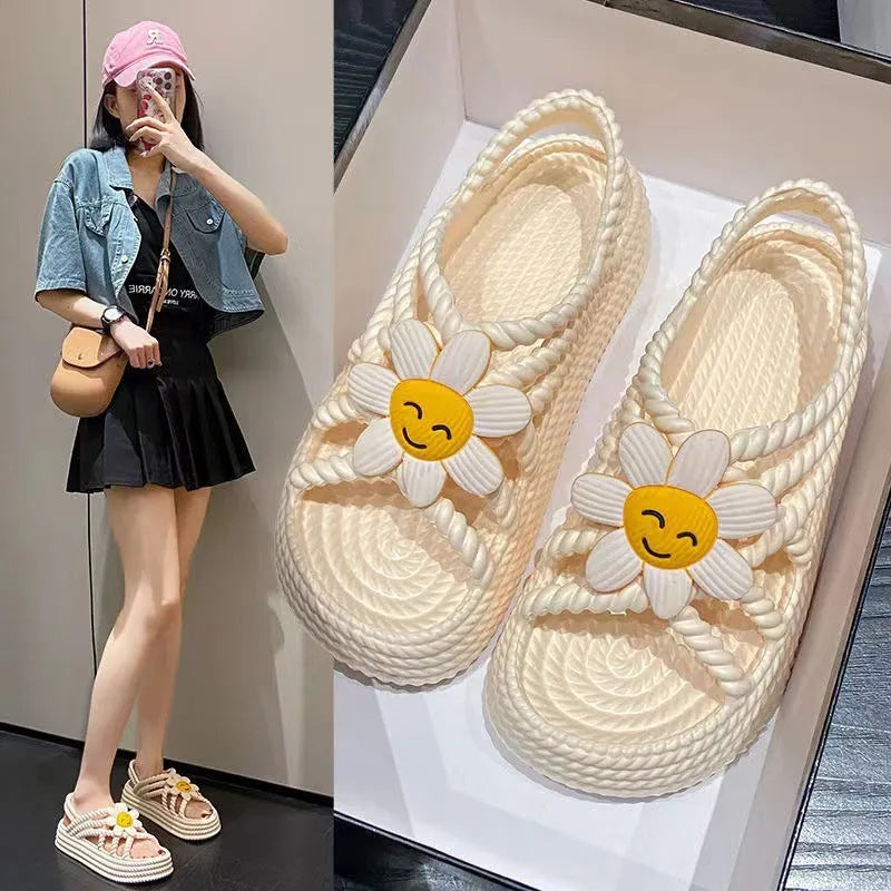 Women's beige PVC sandals with sunflower design, round toe and non-slip sole.