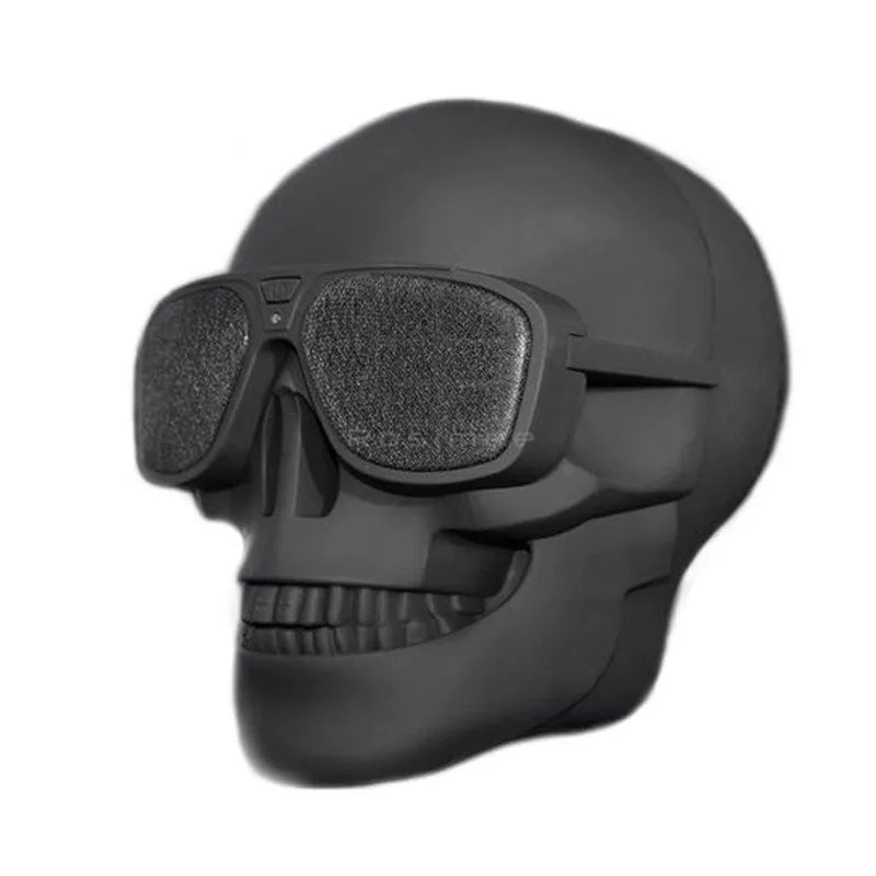Skull-shaped wireless Bluetooth speaker showing front view with controls and available colour options