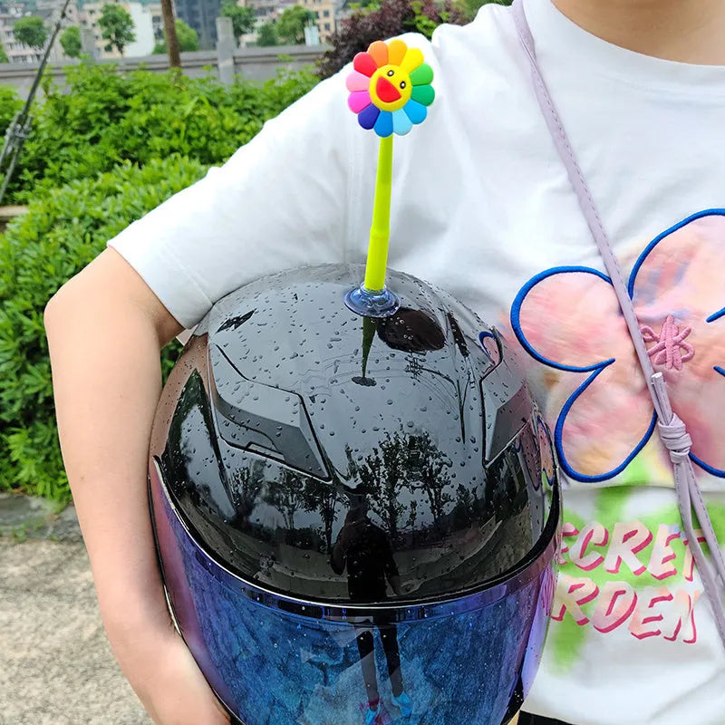Yellow silicone sunflower decoration with a suction cup mount for helmets