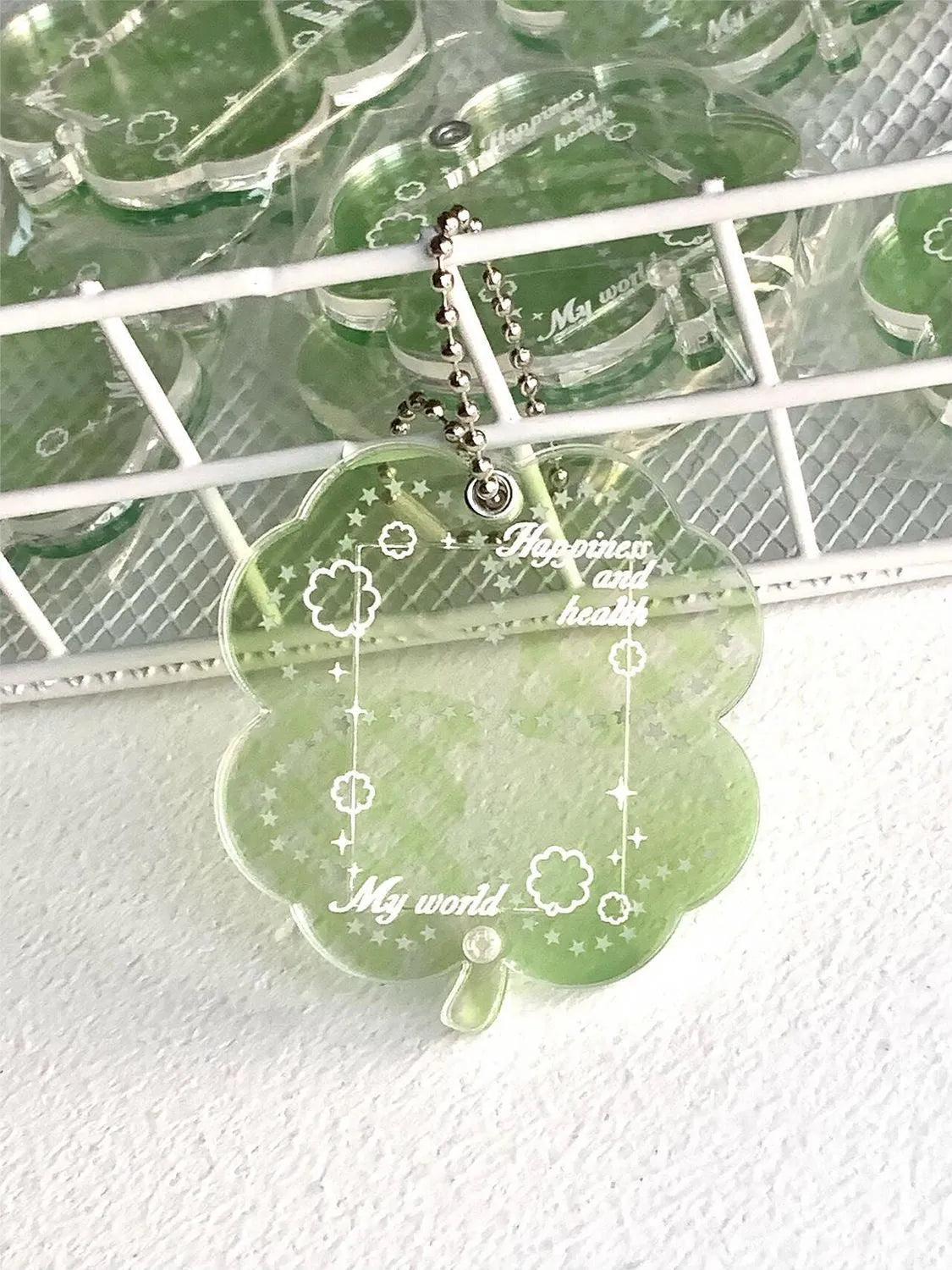 Acrylic four-leaf clover pendant keychain in elegant blue, grass green, or mint green.
