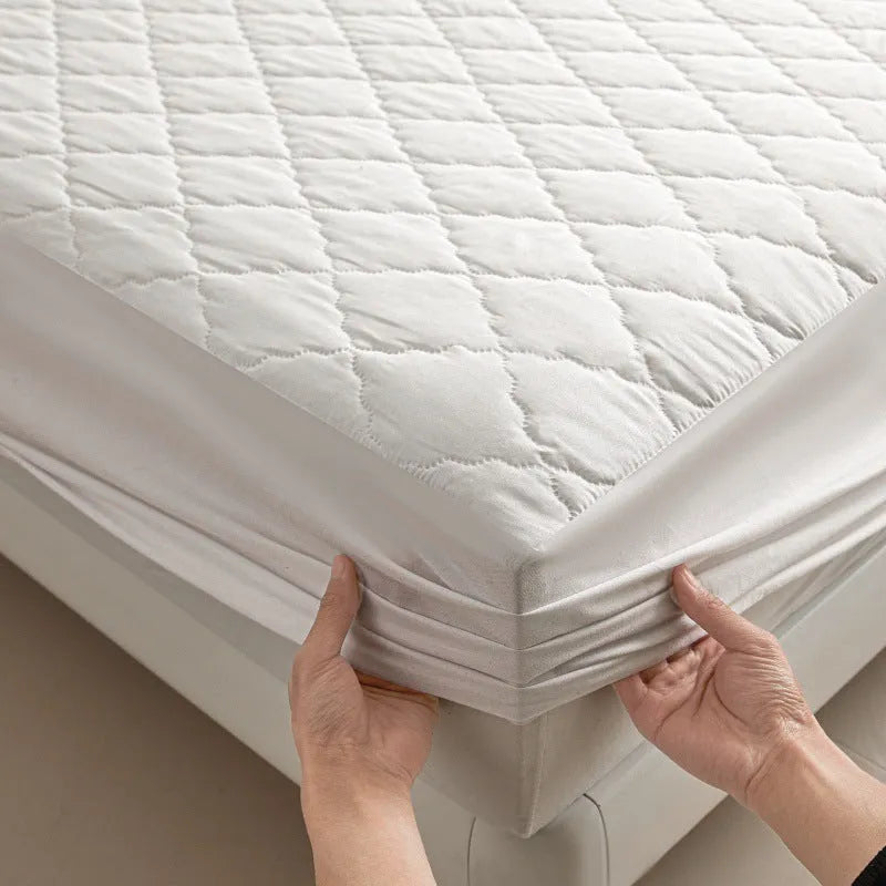 Diamond lattice quilted bamboo fibre mattress protector fitted sheet and pillowcases in solid colour.
