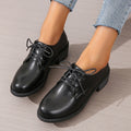Black women's chunky heel ankle boots with rubber sole and professional styling