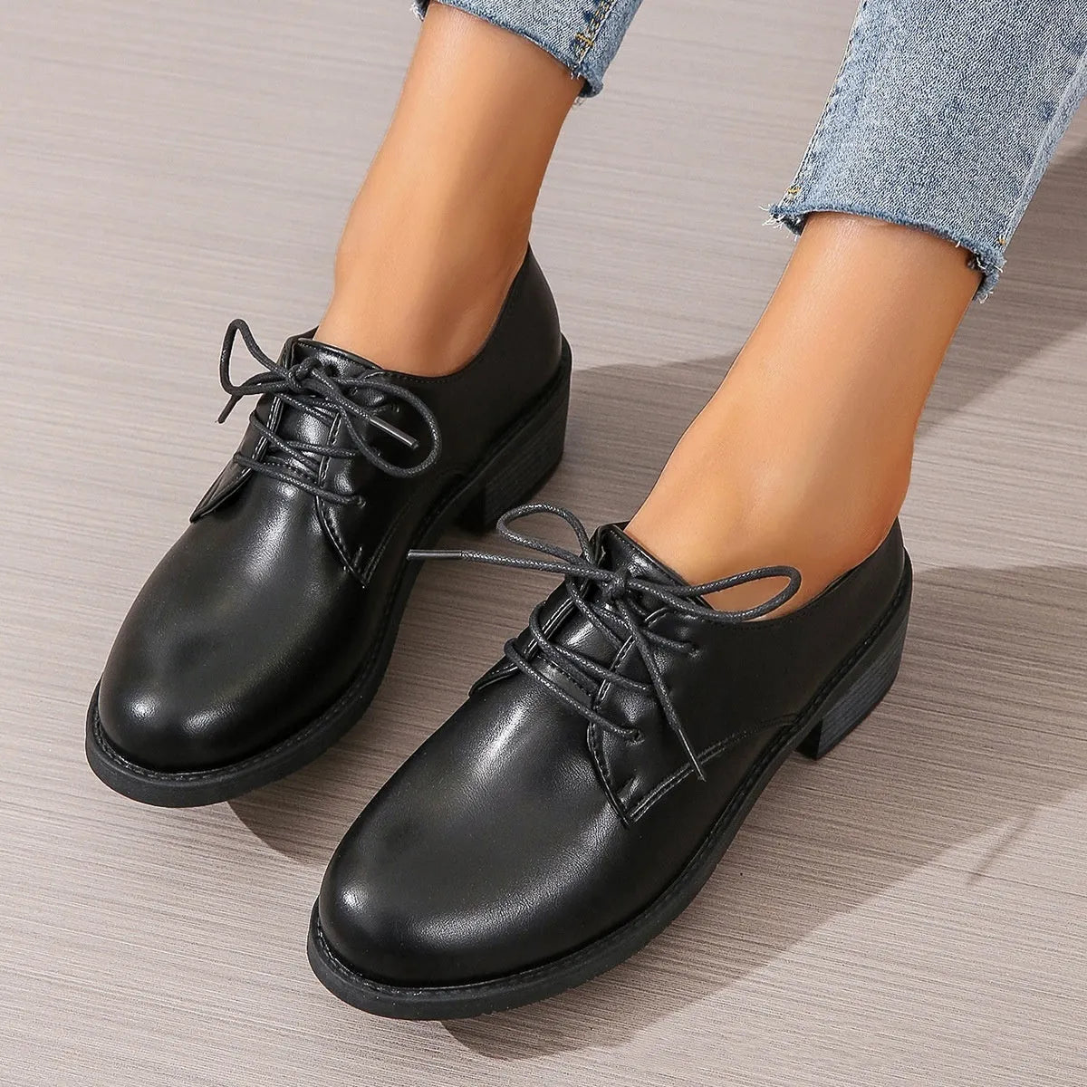 Black women's chunky heel ankle boots with rubber sole and professional styling