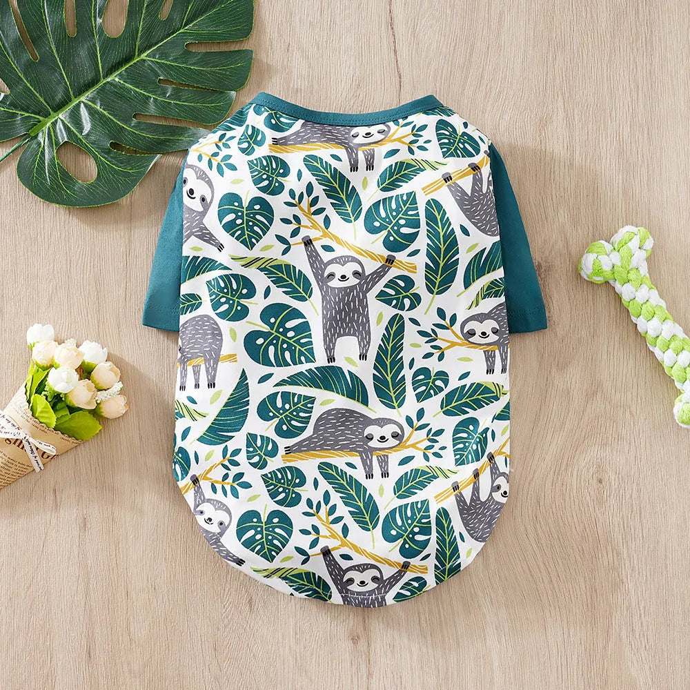 Full-print polyester t-shirt for a small dog, shown in one of six colour variants, with size chart for S, M, L, XL, XXL.