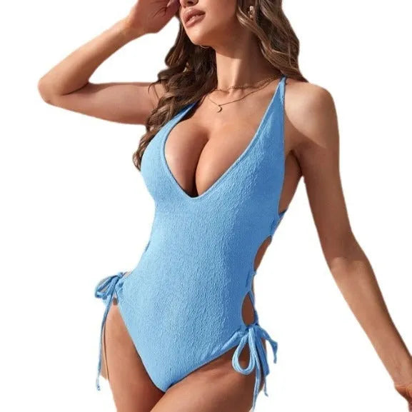 Women's solid colour one-piece bikini swimsuit with a hollow backless tether design.