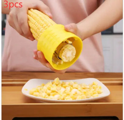 Yellow manual corn thresher kitchen tool with corn-shaped design and stainless steel gear