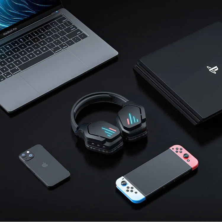 Luminous black wireless over-ear headphones with a headband, shown with a 3.5mm audio cable.