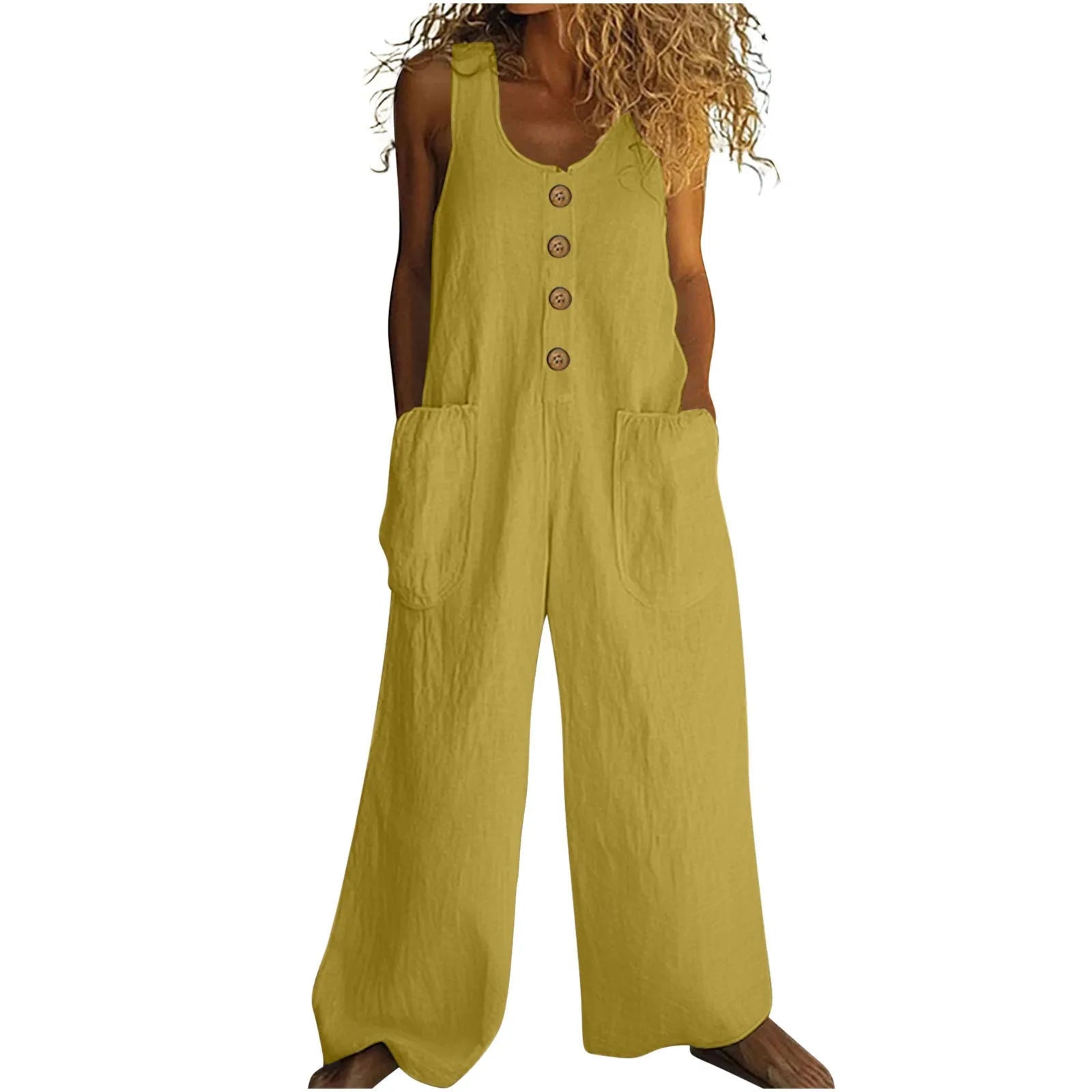 Sleeveless wide leg cotton jumpsuit in peacock green colour showing loose fit and pocket detail.