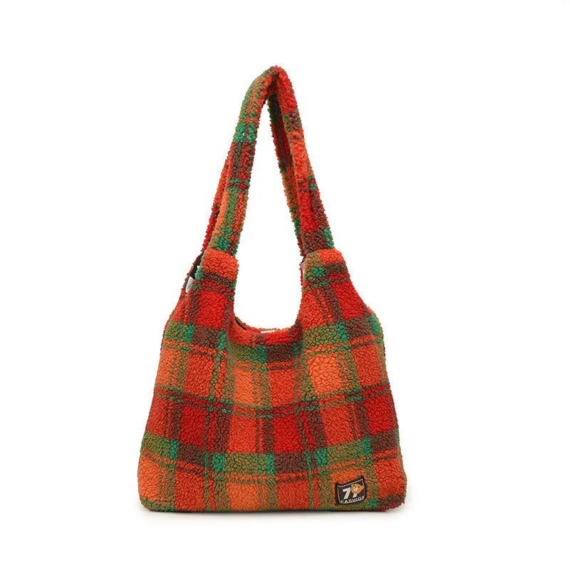 Women's plaid pattern crossbody tote bag showing soft plush material and horizontal square shape with crossbody strap.